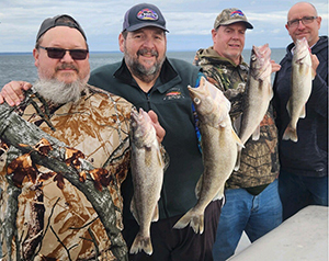 Anglers with Oneida Lake walleye