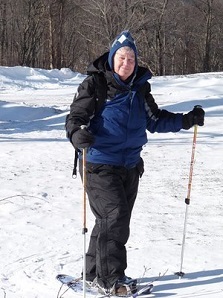 A woman snowshoeing