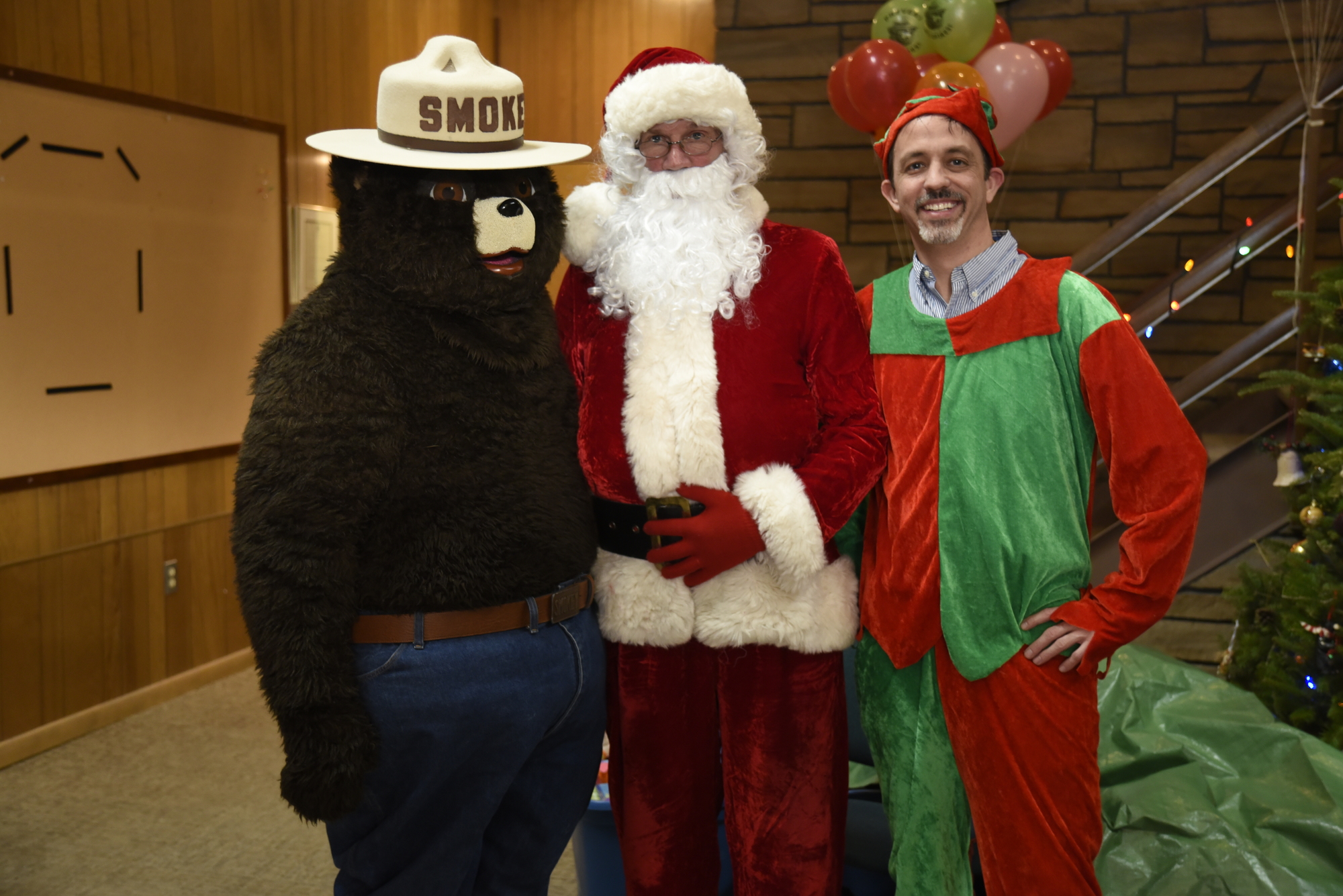 Smokey Bear, Santa and a Helper Elf at 2019 Region 5 Children's Holiday Party