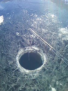 Drilled hole in ice