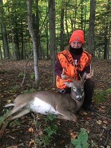 Youth hunter Annie L poses with her harvested deer