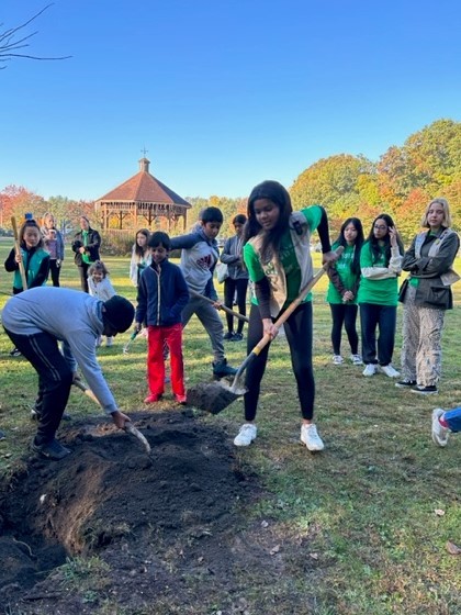 Girl Scouts planting a tree for the Village of Ardsley’s Arbor Day celebration in 2022