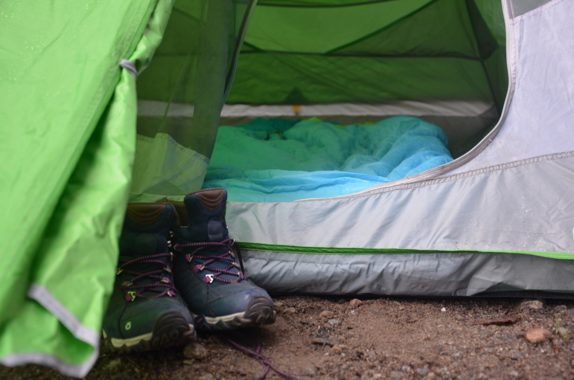 Hiking boots in front of tent