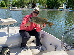 Woman holding smallmouth bass