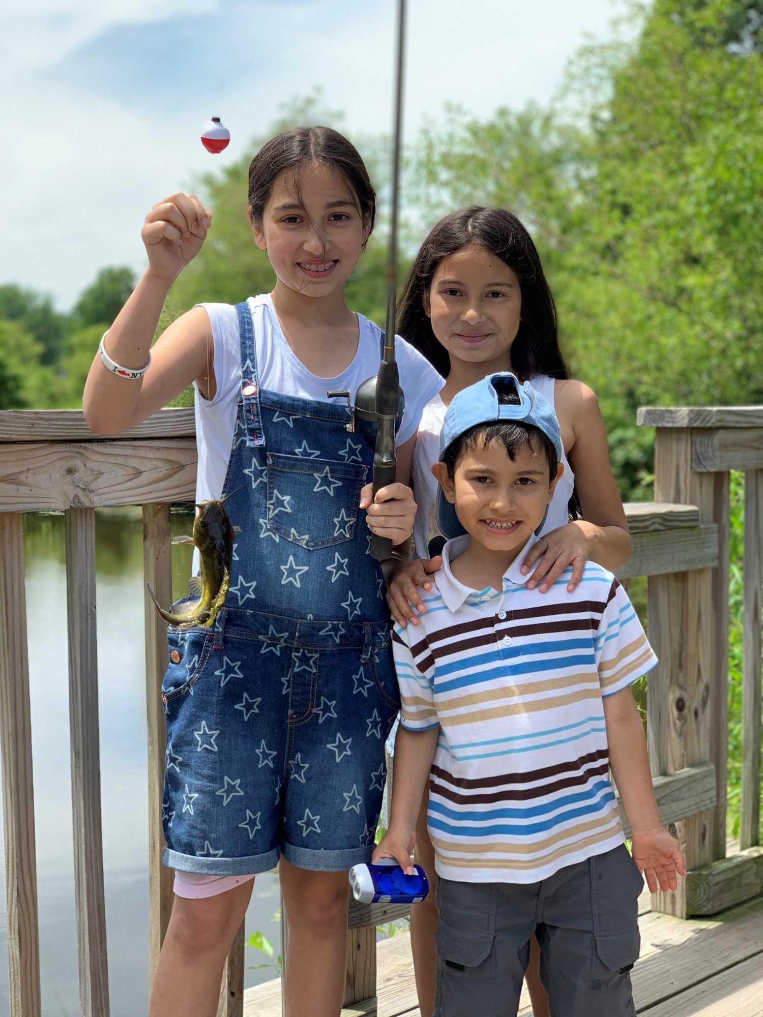 Three children fishing