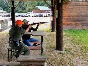 Instructor training student on rifle use
