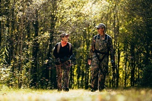 Photo of Two Hunters Walking Together