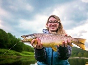 A woman holding a fish