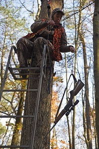 Photo of Hunter in Tree Stand with Fall-Arrest System and All Other Safety Tools Equipped