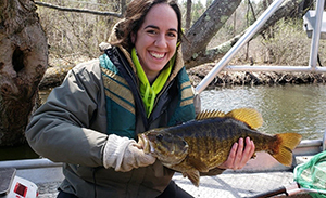Megan Beckwith holding a smallmouth bass.