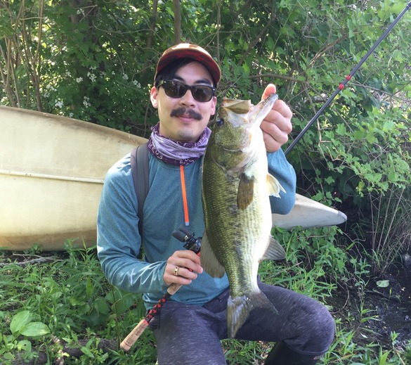 Angler holding up a largemouth bass