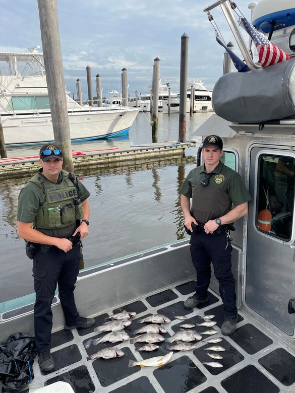 ECOs Farner (left) and Rappold (right) conduct marine fishing compliance checks in Jamaica Bay