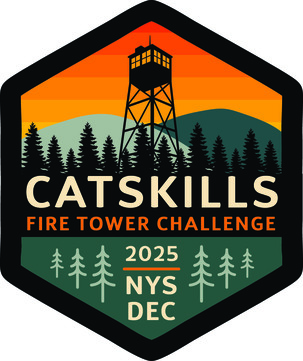 A patch design depicting a silhouette of a fire tower against an orange sky, green mountains and black trees. 