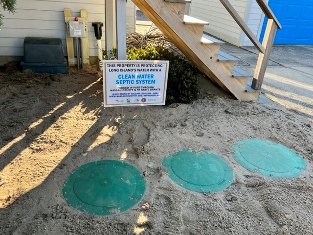IA System Installed in the ground with program sign behind it