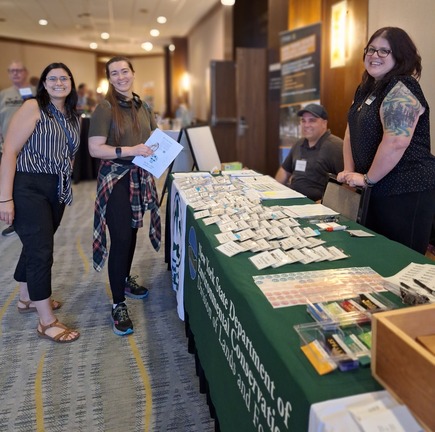 Registration table at the 2024 ReLeaf Conference in Albany