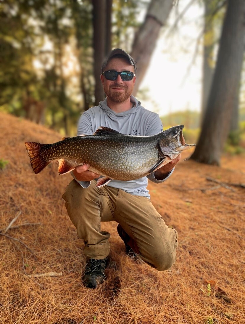 Angler holding the new 2025 state record brook trout