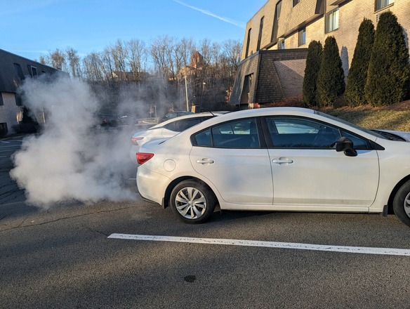Car with visible exhaust.