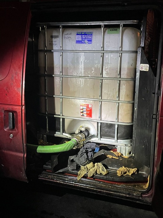 Oil tank in back compartment of a van