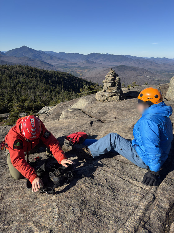 Ranger tending to subject on Cascade Mountain