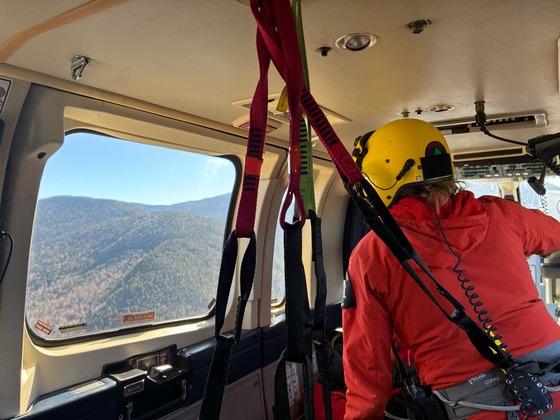 Ranger in helicopter on the way to Trap Dike rescue