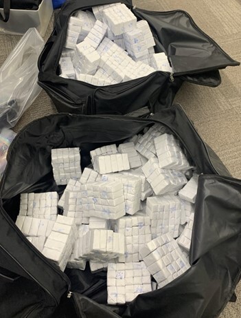 Blockbuster Suitcases containing “blocks” of fentanyl recovered by the investigation