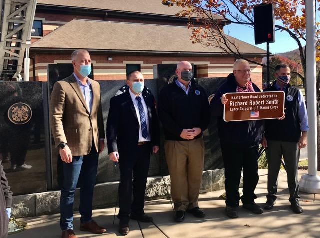 Supervisor Albra and Town officials stand with the brother of Richard R. Smith, who was killed in Vietnam.