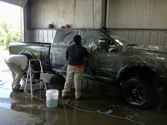 Two residents of Finger Lakes Residential Center working at Hill's Fresh and Clean