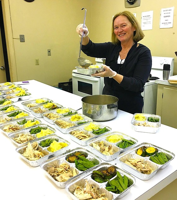 Serving food at a local food pantry. 
