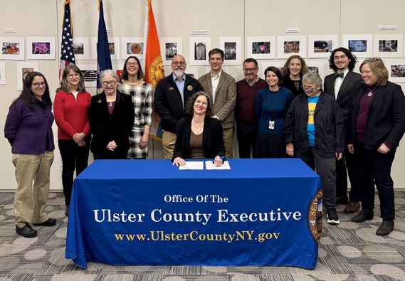 County Executive Metzger and local officials and environmental leaders as she signs EO3 on Climate