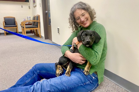 County Executive Metzger with Birch, the SPCA puppy-gram
