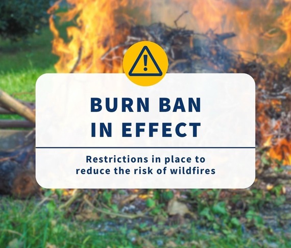 Graphic saying "burn ban in effect" with a brush fire in the background