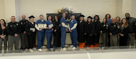 Recent IGNITE program graduates with their diplomas