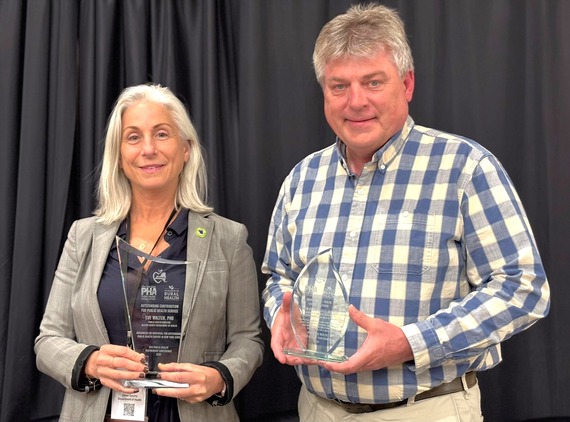 Dr. Eve Walter and Tim Rose P.E. with their awards