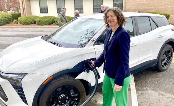 County Executive Metzger charging an EV with the new Trudy Center chargers