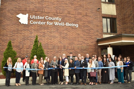 County Executive Metzger and other State and County officials cutting the ribbon outside the Center for Well-Being