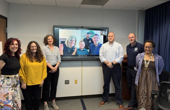 Group photo with County Executive Metzger, Commissioner Erichsen, other County Officials, and Ledger and his family on zoom