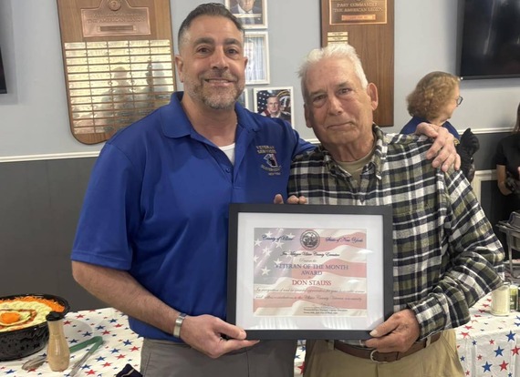 VSA Director Cozzupoli presenting Don Stauss with the Veteran of the Month award