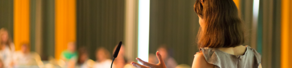 A speaker giving a presentation to an audience.