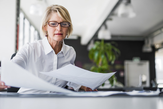 Woman looking through papers