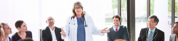 A doctor leading a meeting.