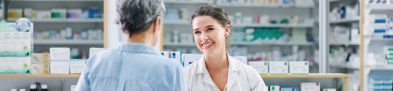 A pharmacist helping a patient.