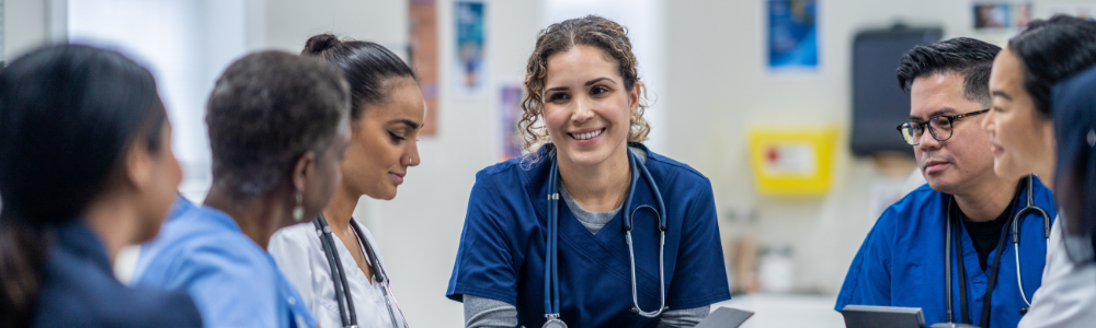 Doctors and Nurses sitting at a table
