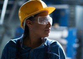 woman wearing a hardhat and safety goggles