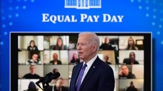 President Biden speaks at a podium on Equal Pay Day