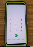 photo of a cell phone on the dialing page