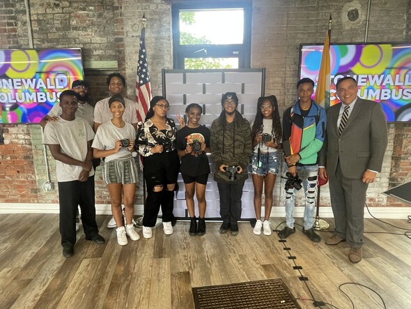 Mayor Ginther with a group of teens at Stonewall Columbus