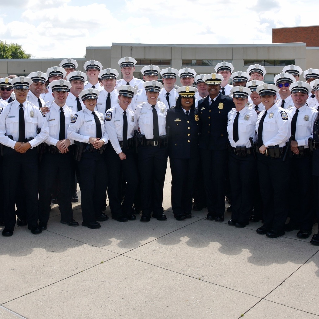 141st police recruit class stands with Chief Bryant and Asst Chief Potts