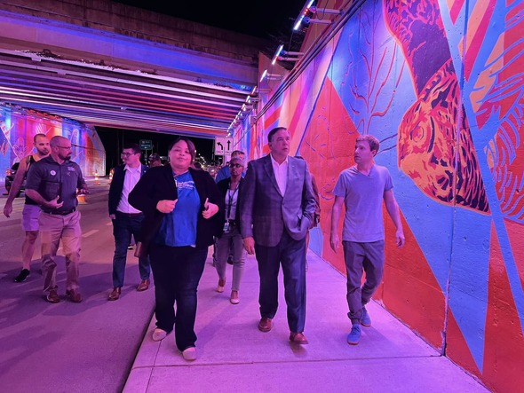 Mayor Ginther walks through the newly painted Sullivant Avenue underpass