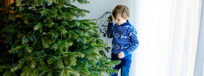 Child with Christmas tree