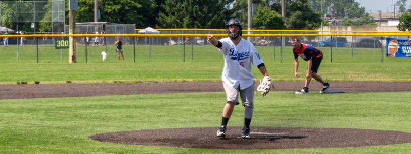 Person pitching a softball